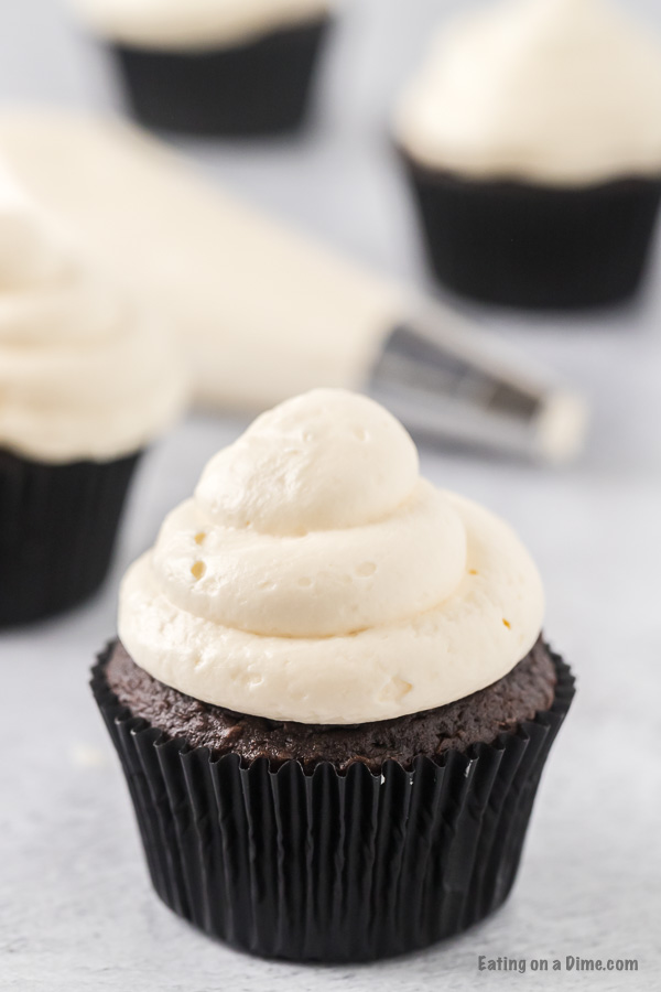Close up image of chocolate cupcake with marshmallow fluff frosting. 