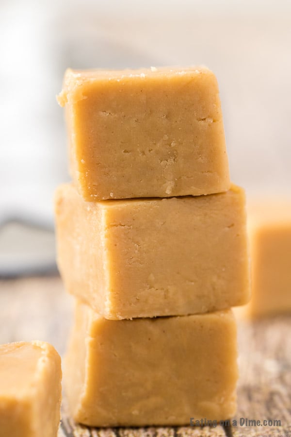Close up image of peanut butter fudge stacked on a table. 