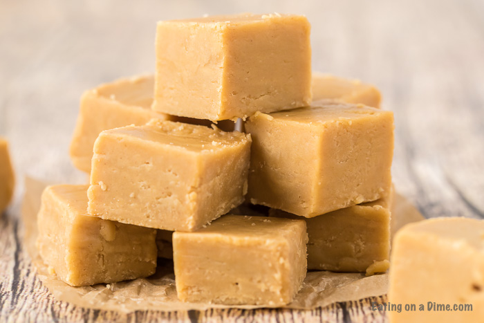 Close up image of peanut butter fudge stacked on a table. 