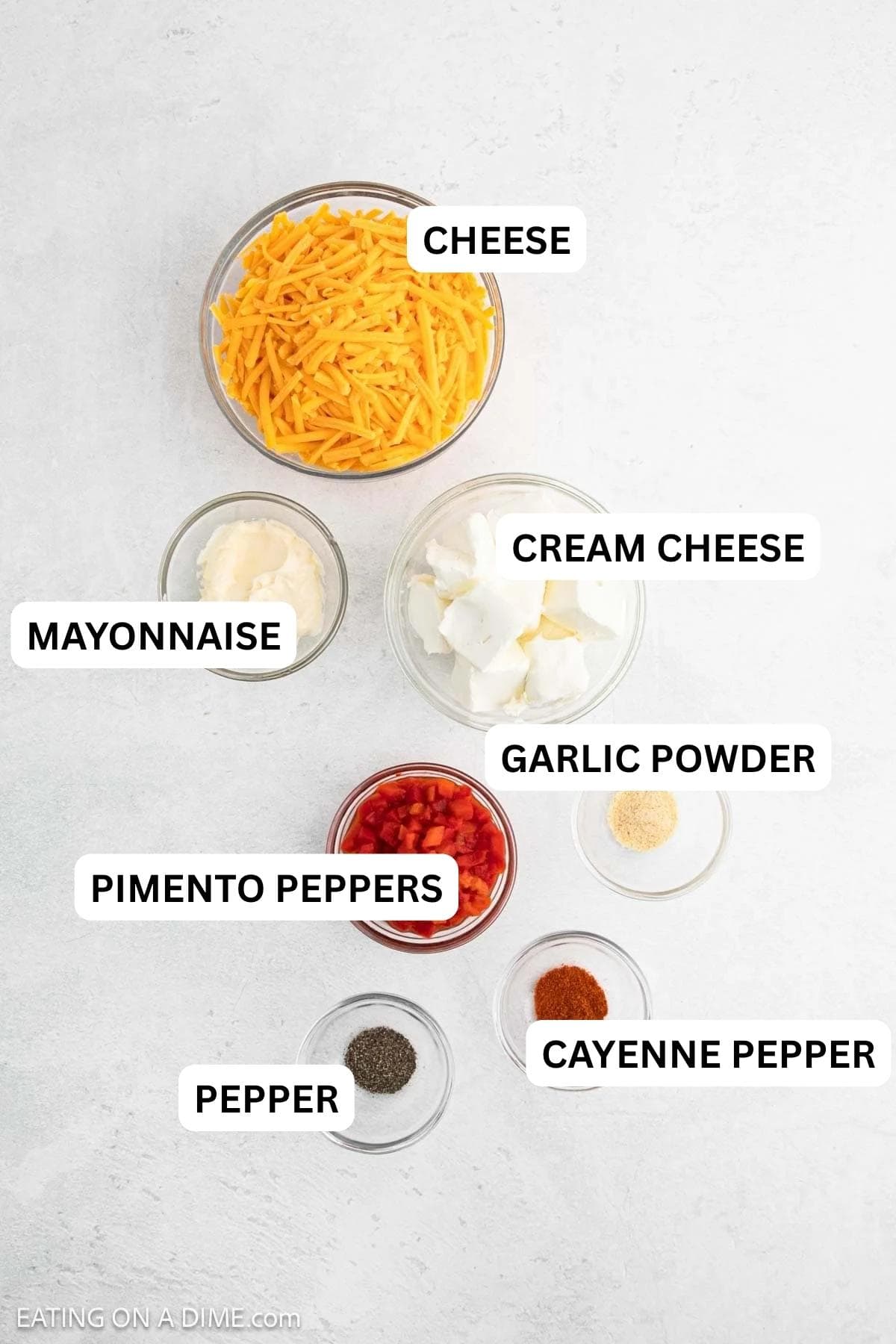 Ingredients needed to make this recipe includes cheese, cream cheese, pimento peppers, mayonnaise, garlic powder and cayenne pepper.
