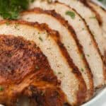 Sliced Air Fryer Turkey Breast on a platter.