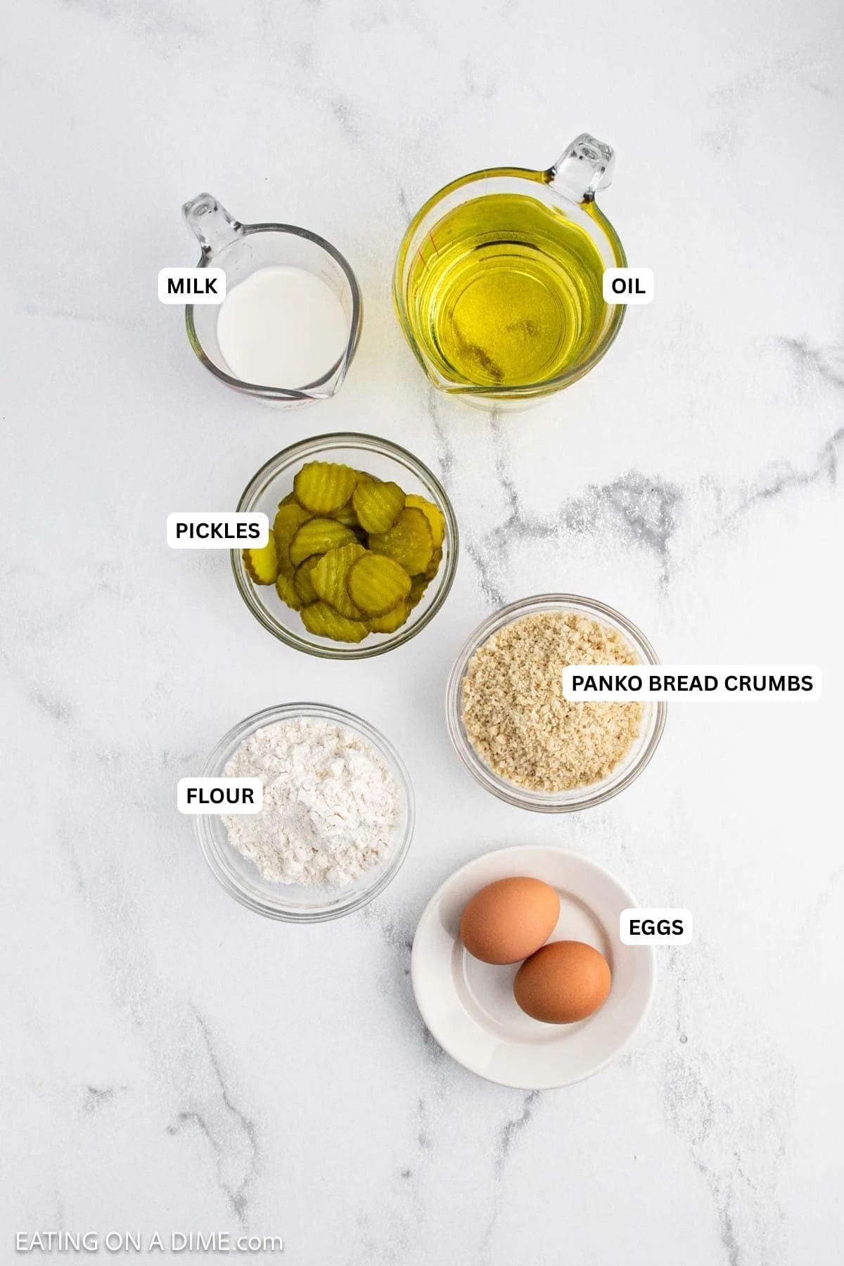 Ingredients for recipe: milk, oil, pickles, breadcrumbs, flour and eggs.