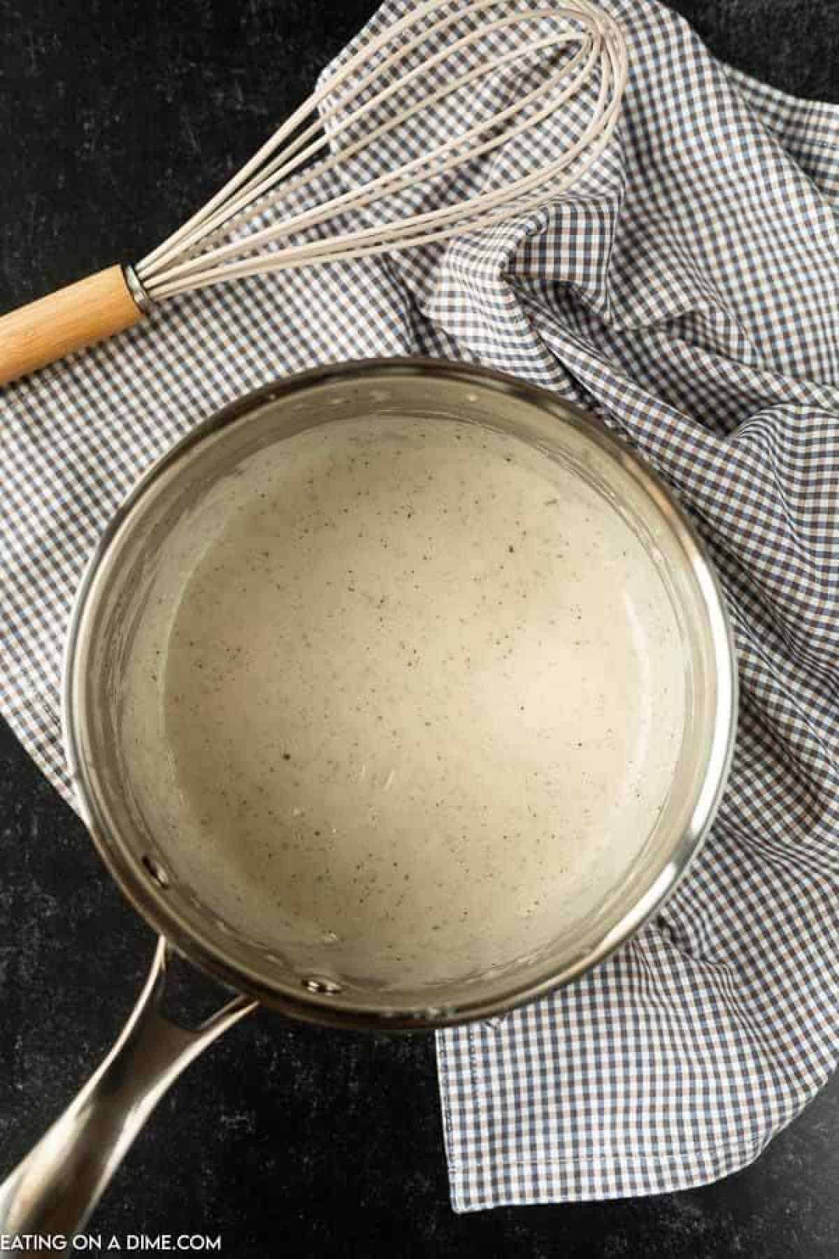 Learn how to make gluten free cream of chicken soup recipe. This gluten free cream soup base is so simple. Gluten free substitute for cream of chicken soup. Pan of finished recipe.