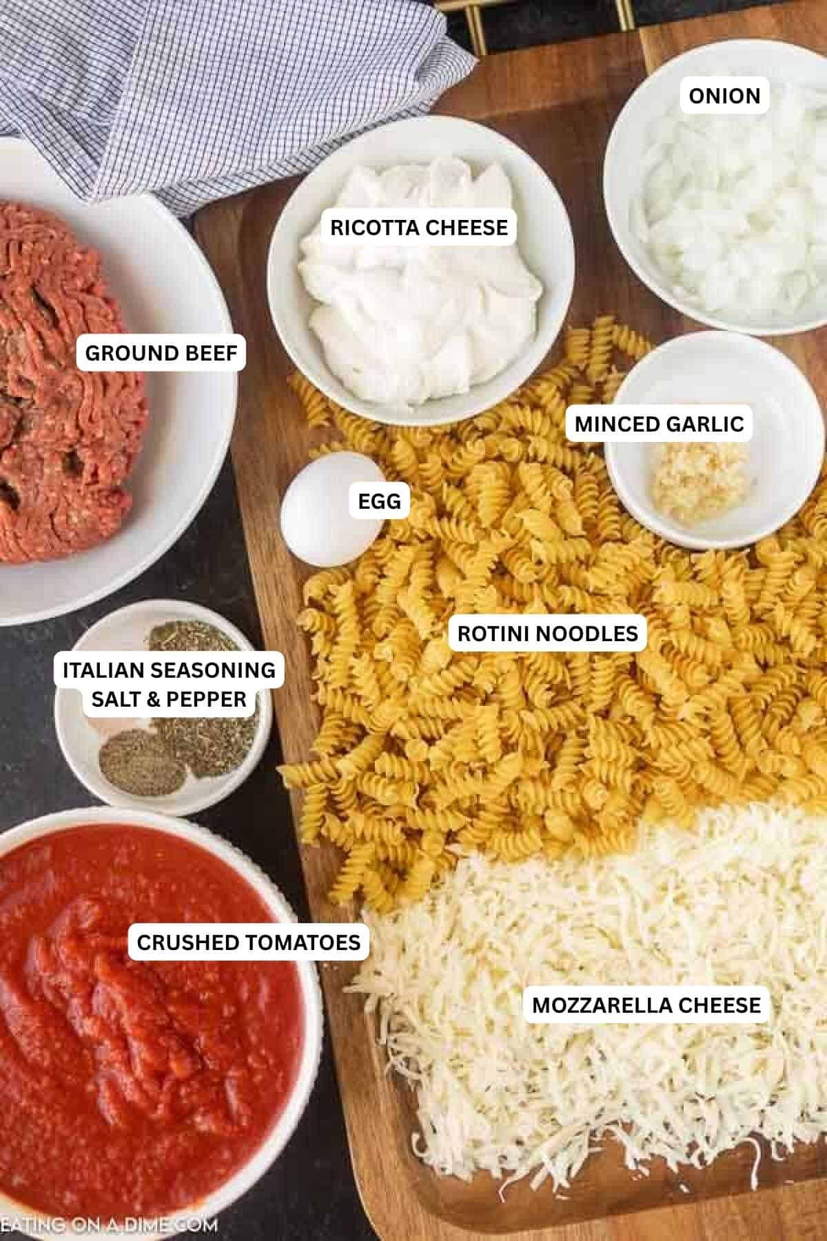 This EASY lasagna casserole recipe is cheesy and oh so yummy! Quick and easy lasagna casserole is the best dinner for busy nights. You will love lasagna style pasta bake. Freeze this easy lasagna bake for a quick and easy meal. Ingredients for recipe: rotini noodles, cheese, crushed tomatoes, Italian seasoning, salt, pepper, minced garlic, egg, ground beef, ricotta cheese and onion.