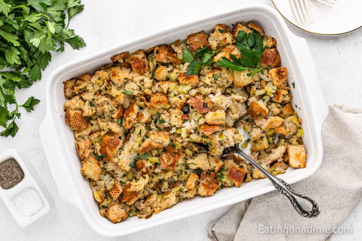 Stuffing in a white baking dish.