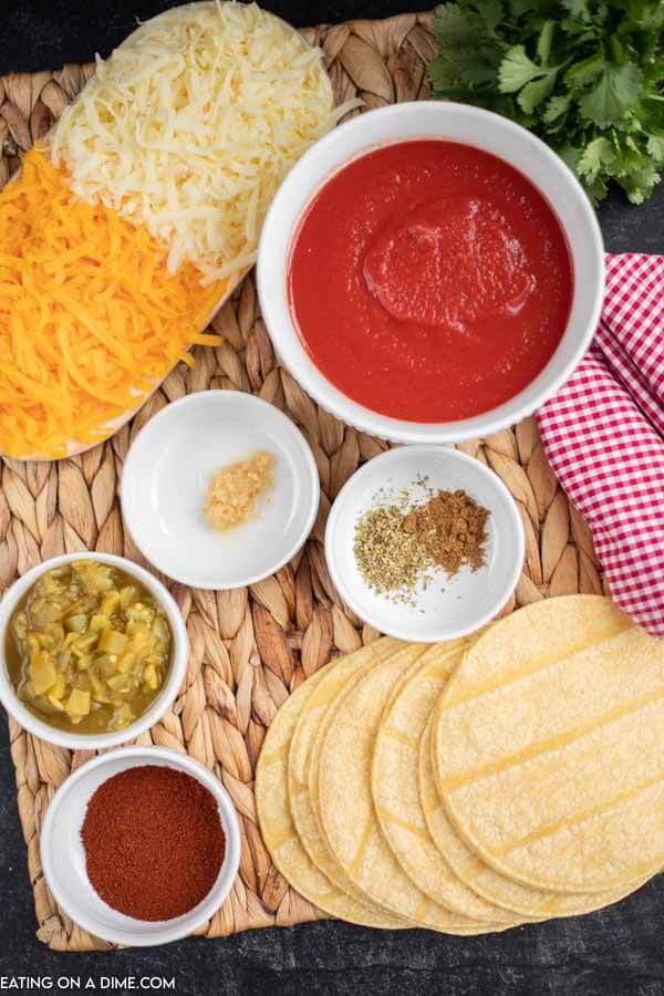 Ingredients for recipe: shredded cheese, tomato sauce, seasonings, tortillas. 