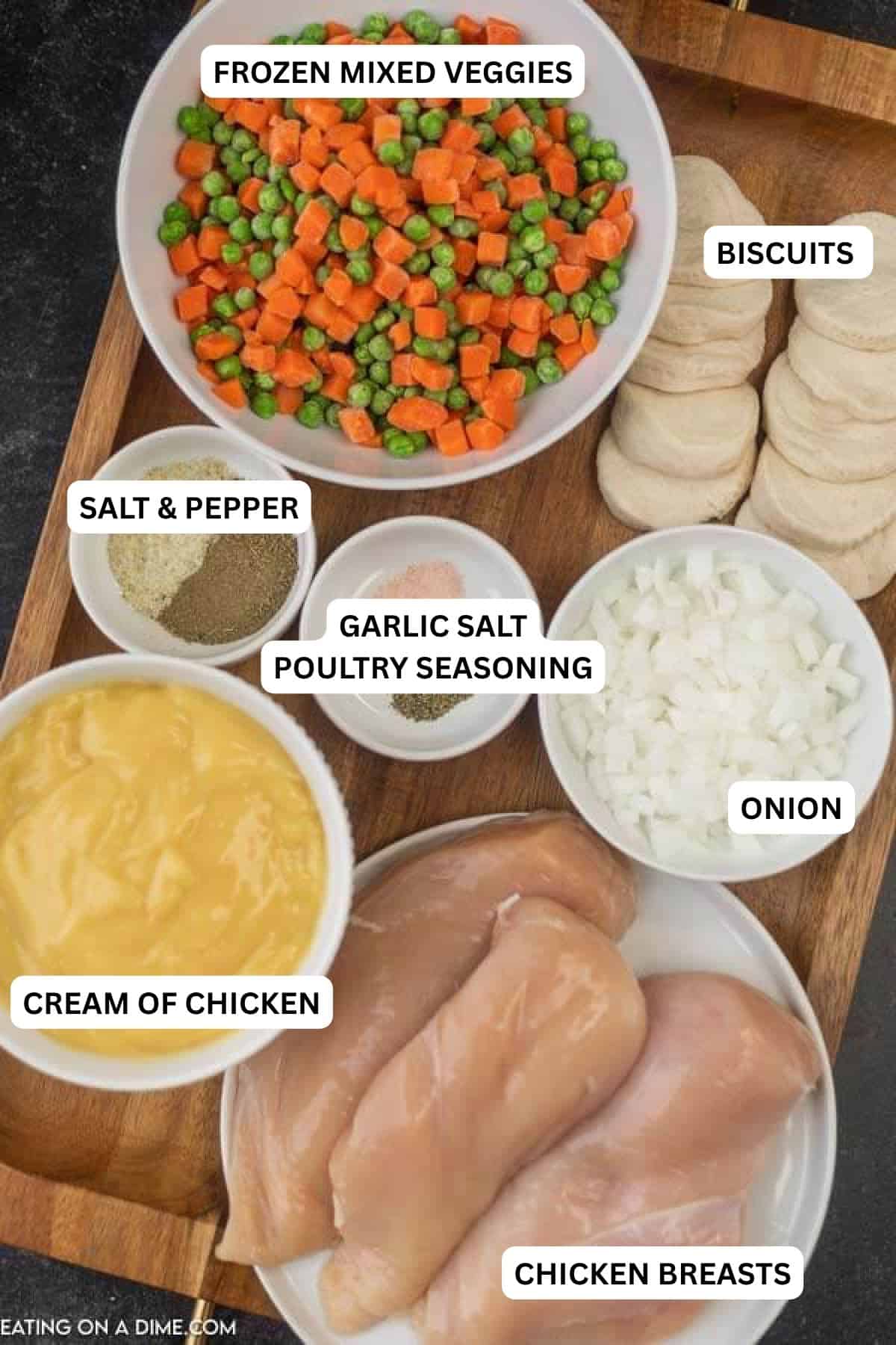 ingredients for recipe - frozen mixed veggies, biscuits, salt and pepper, garlic salt, poultry seasoning, onion, cream of chicken, chicken breasts. 