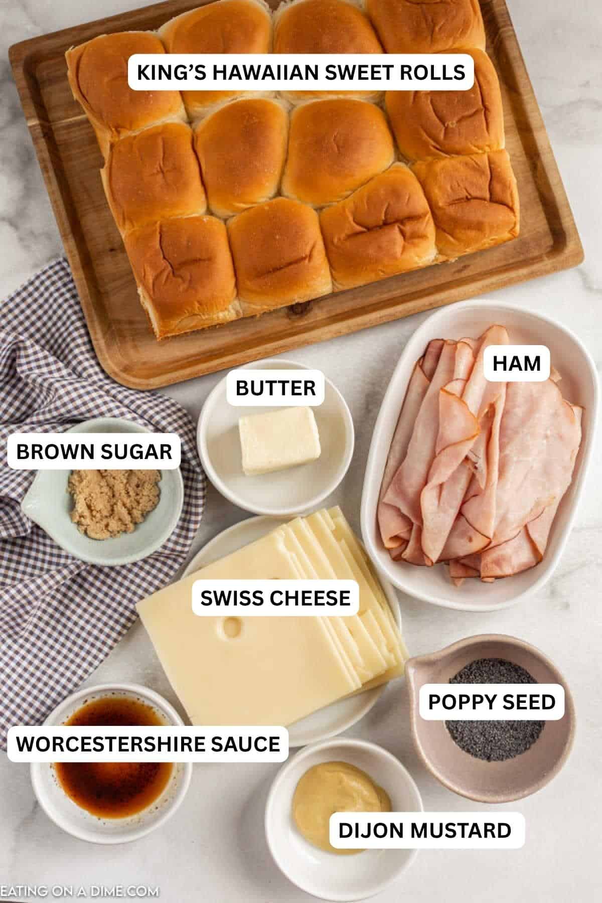 These Hawaiian ham and cheese sliders recipe are easy to make. They are the best Ham and cheese sliders! You'll love these Kings Hawaiian Ham and Cheese Sliders with brown sugar! These are perfect to make ahead to serve at any party or get together! #eatingonadime #hamandcheesesliders #appetizerrecipes Ingredients for recipe: King's Hawaiian Sweet Rolls, brown sugar, butter, ham, Swiss cheese, poppy seed, Worcestershire sauce, Dijon mustard.