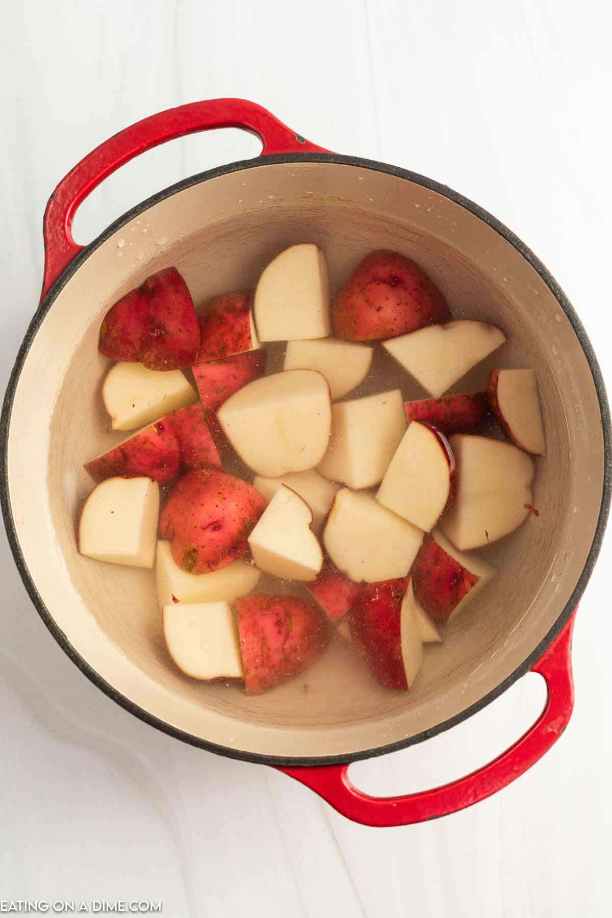 Pot with potatoes and water. 