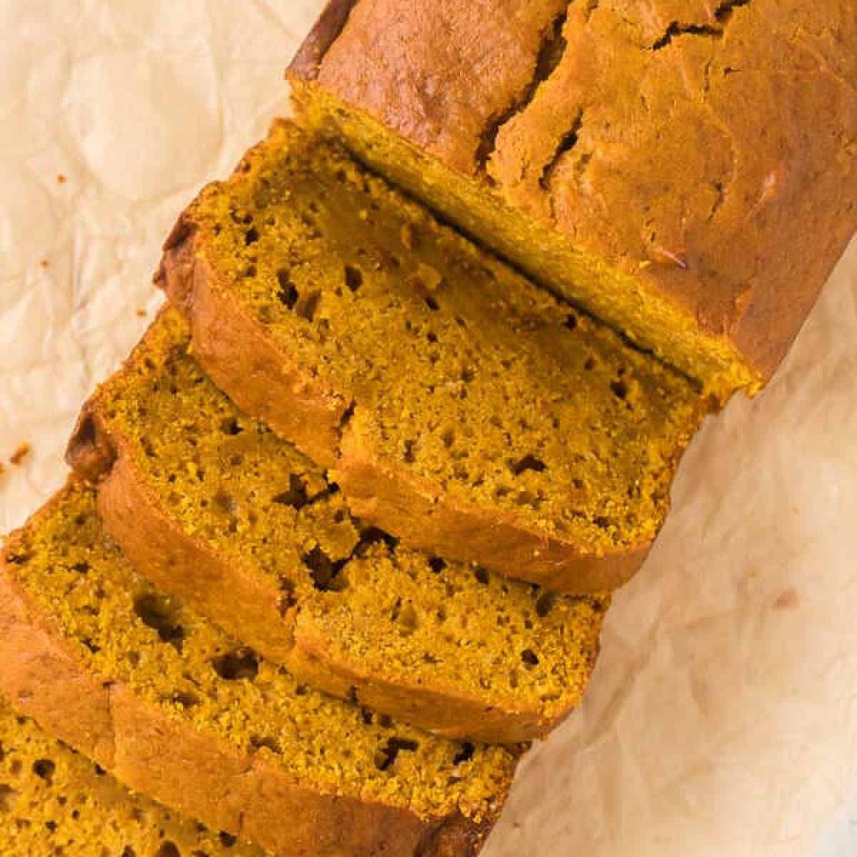 Pumpkin Bread being sliced and served.