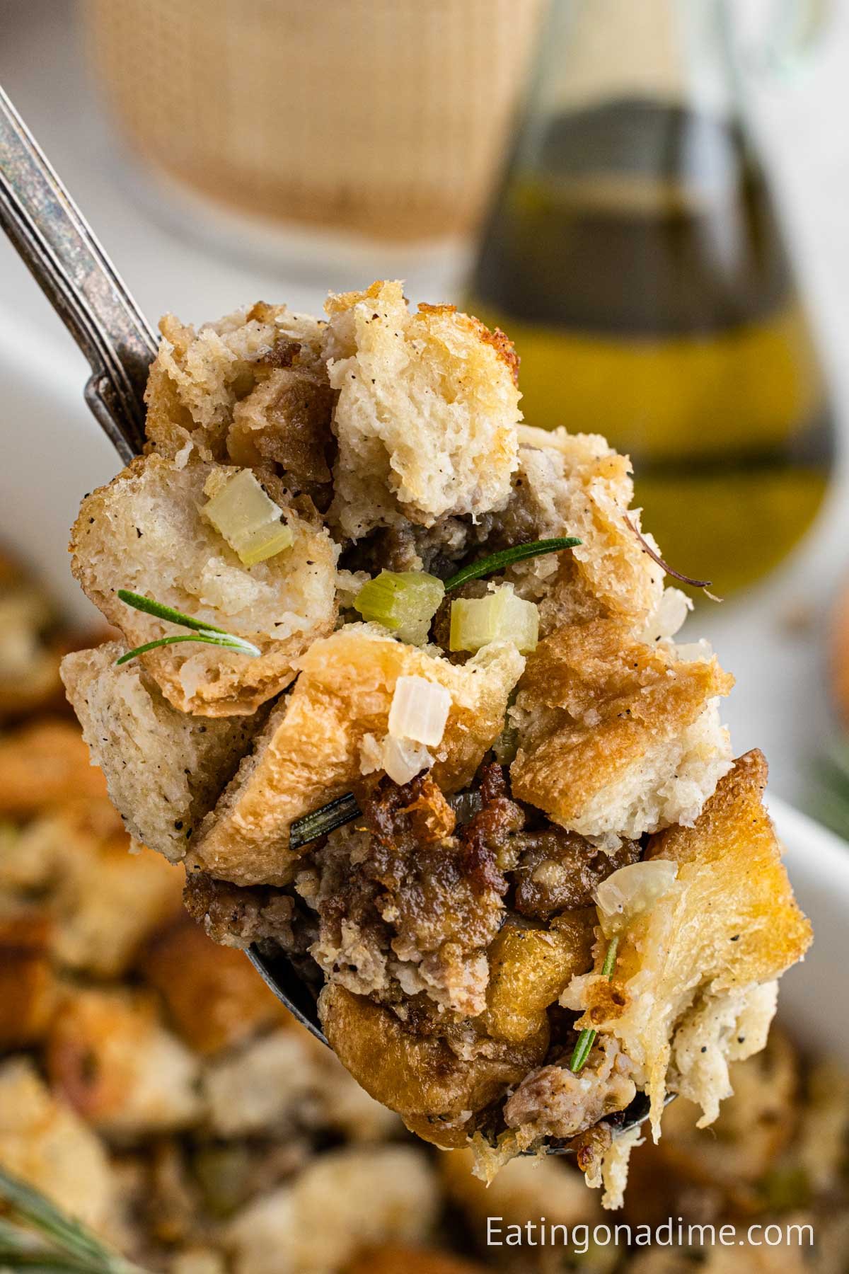 Close up image of sausage stuffing on a serving spoon