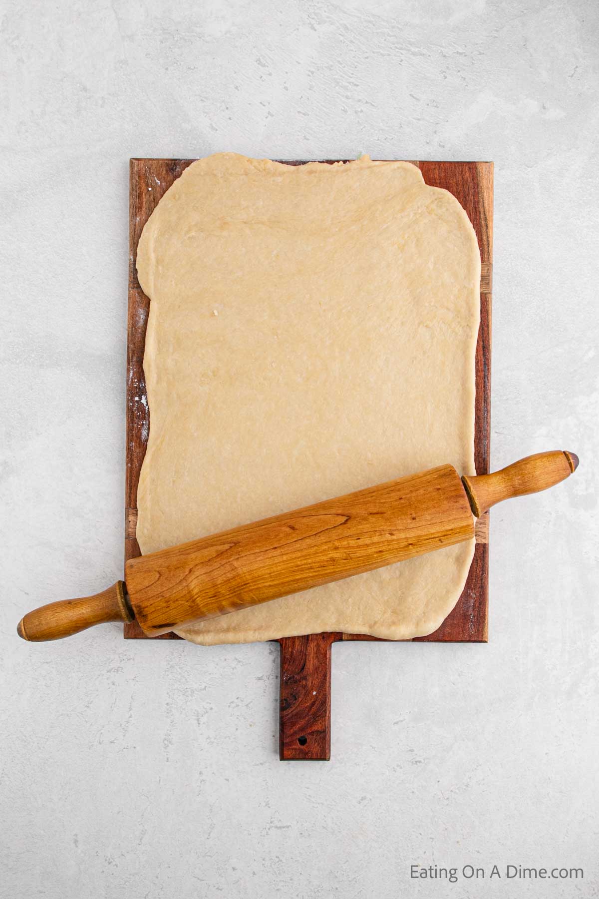 Rolling the dough with a rolling pin 