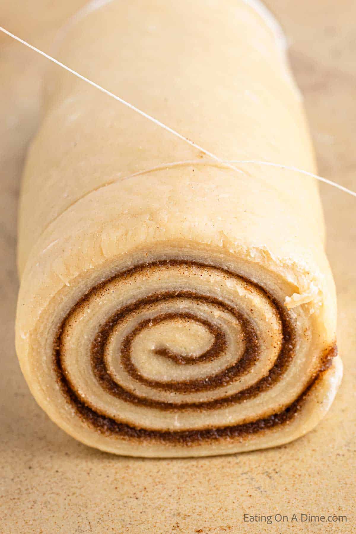 Rolling dough to begin to cut with floss