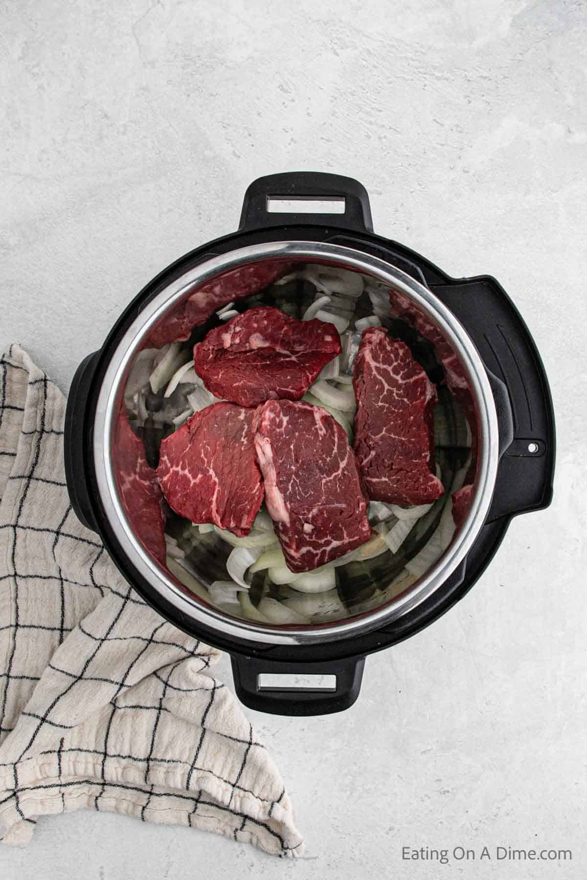 Topping the steak on the slice ones in the instant pot