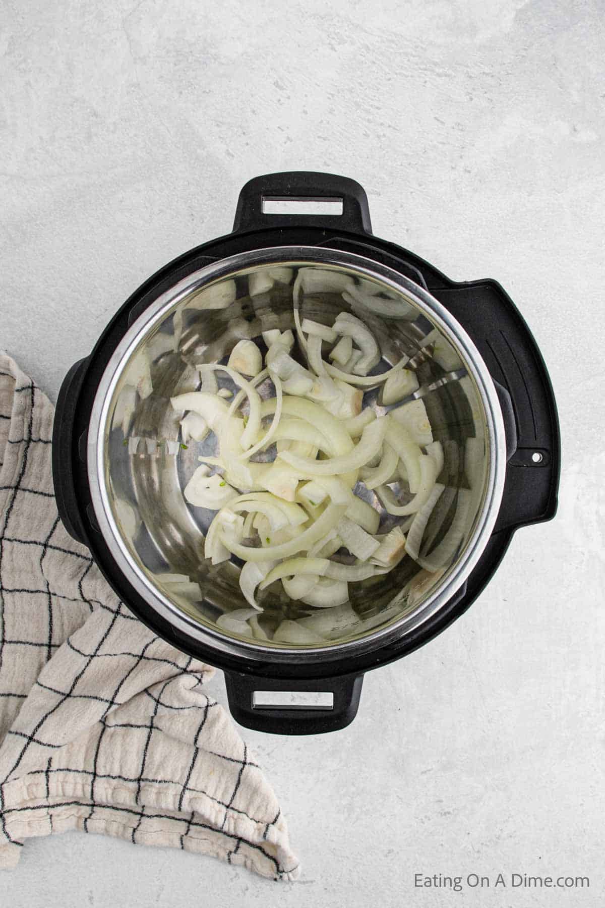 Placing in slice onions in the instant pot