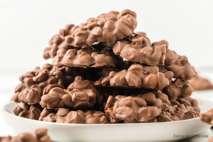 Close up image of chocolate peanut clusters stacked. 
