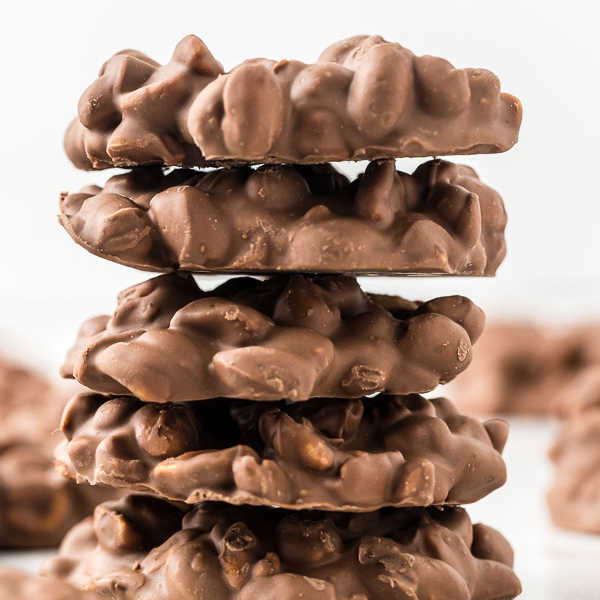 Close up image of peanut clusters stacked. 