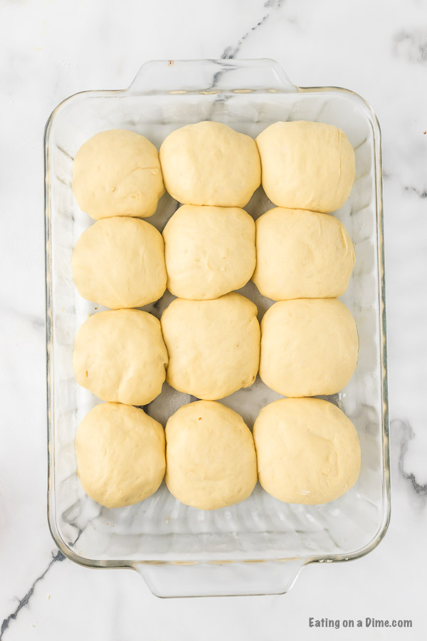 Dough balls doubled in size in a baking dish