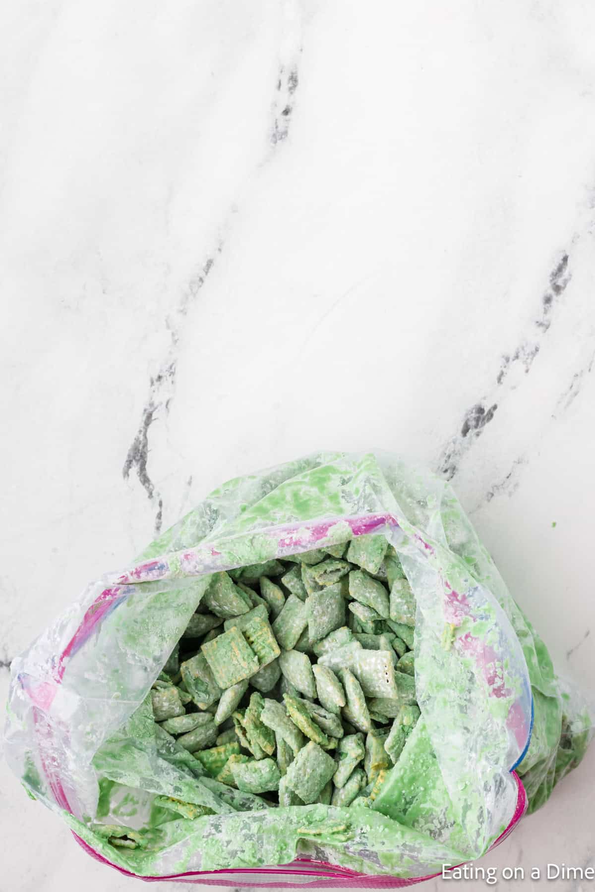 Green Coated Chex Cereal in a zip lock bag 