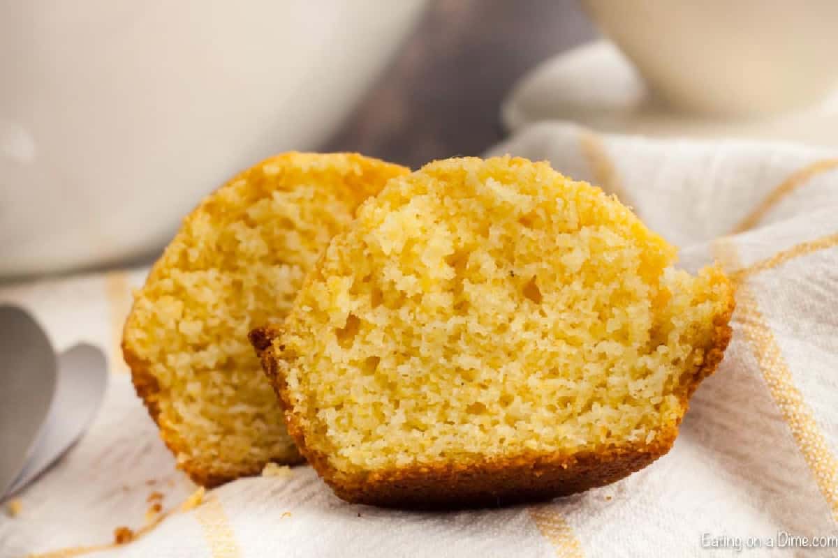 Cornbread Muffins are just so easy to make and much better than those store bought mixes. This cornbread muffin recipe is delicious and a family favorite. corn muffin sliced in half