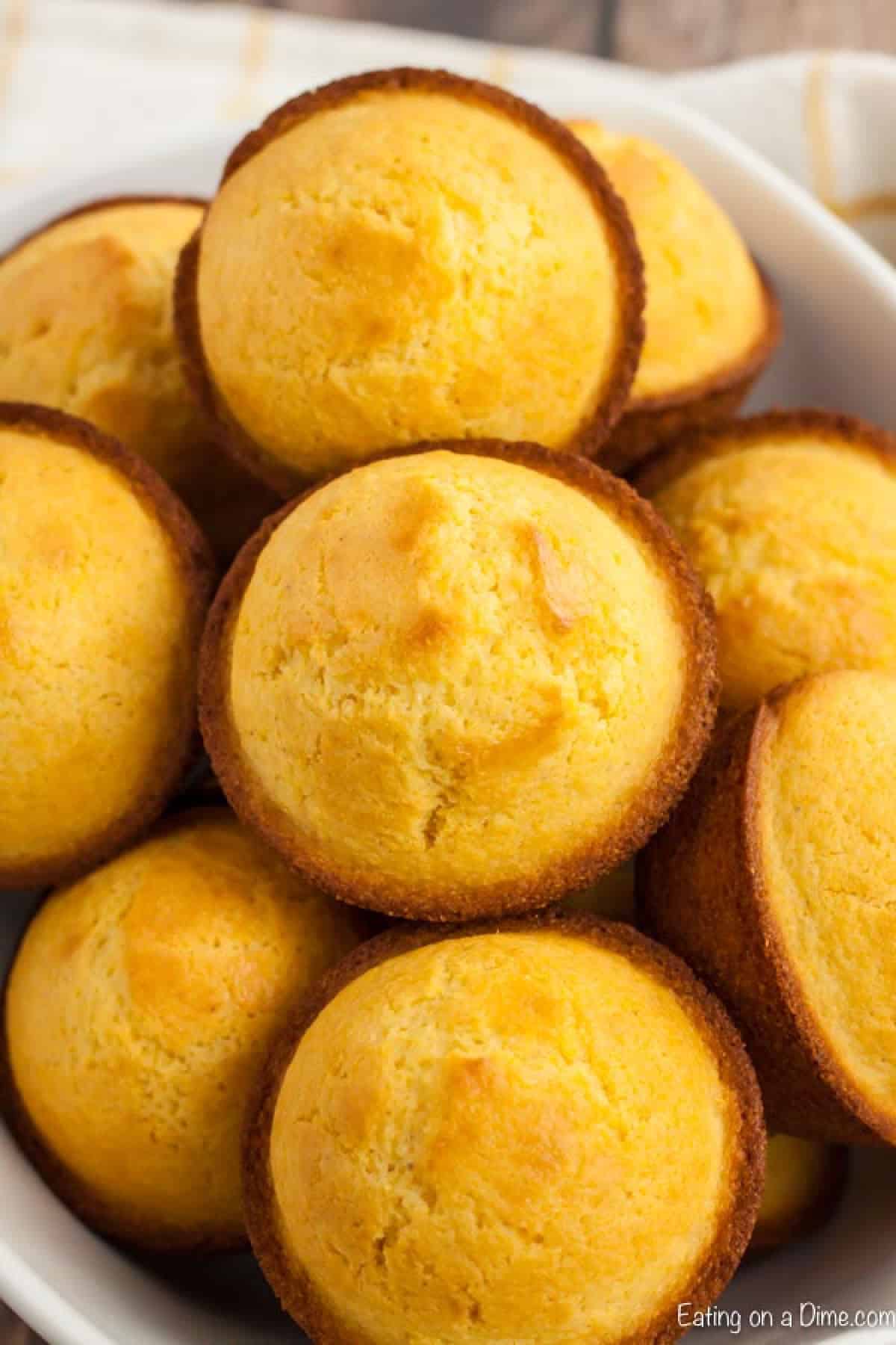Cornbread Muffins are just so easy to make and much better than those store bought mixes. This cornbread muffin recipe is delicious and a family favorite. bowl of corn muffins
