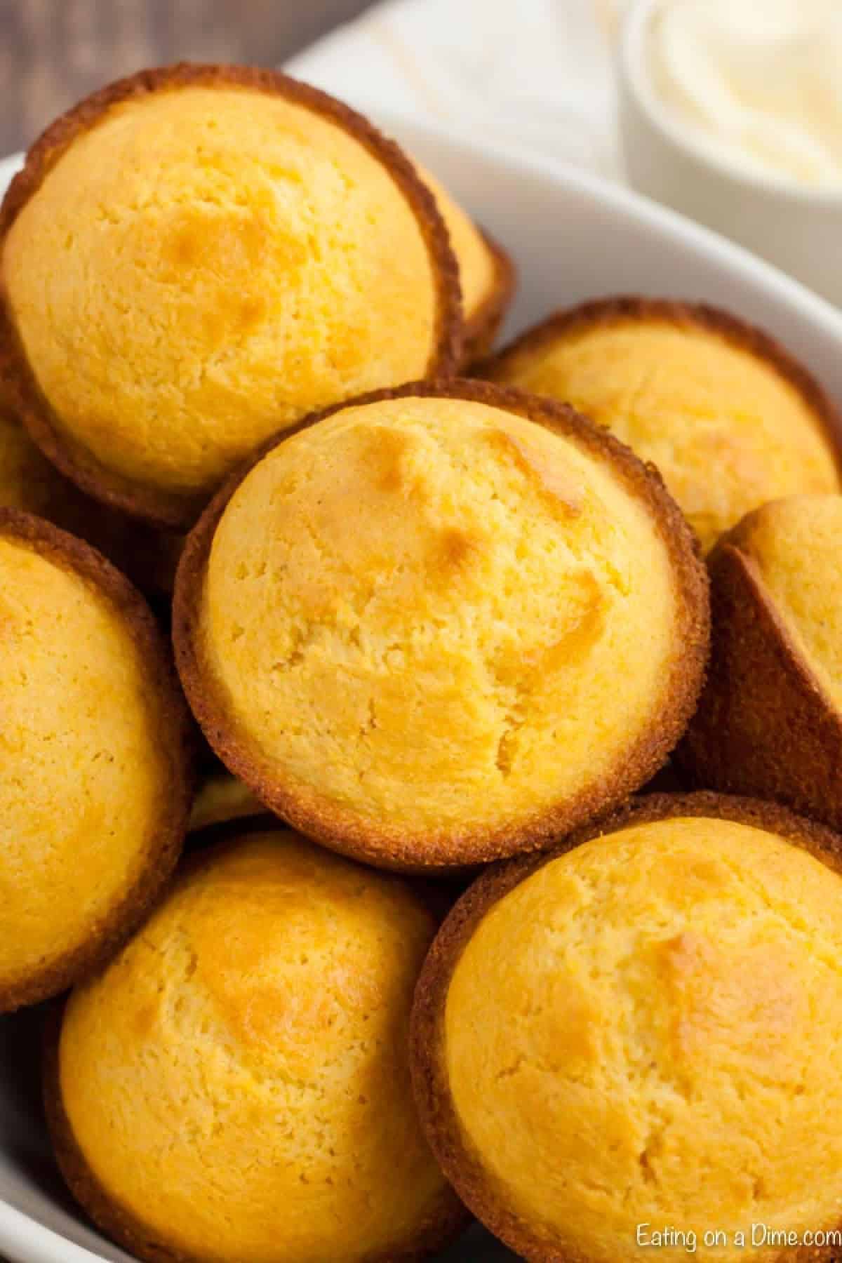 Cornbread Muffins are just so easy to make and much better than those store bought mixes. This cornbread muffin recipe is delicious and a family favorite. bowl of corn muffins