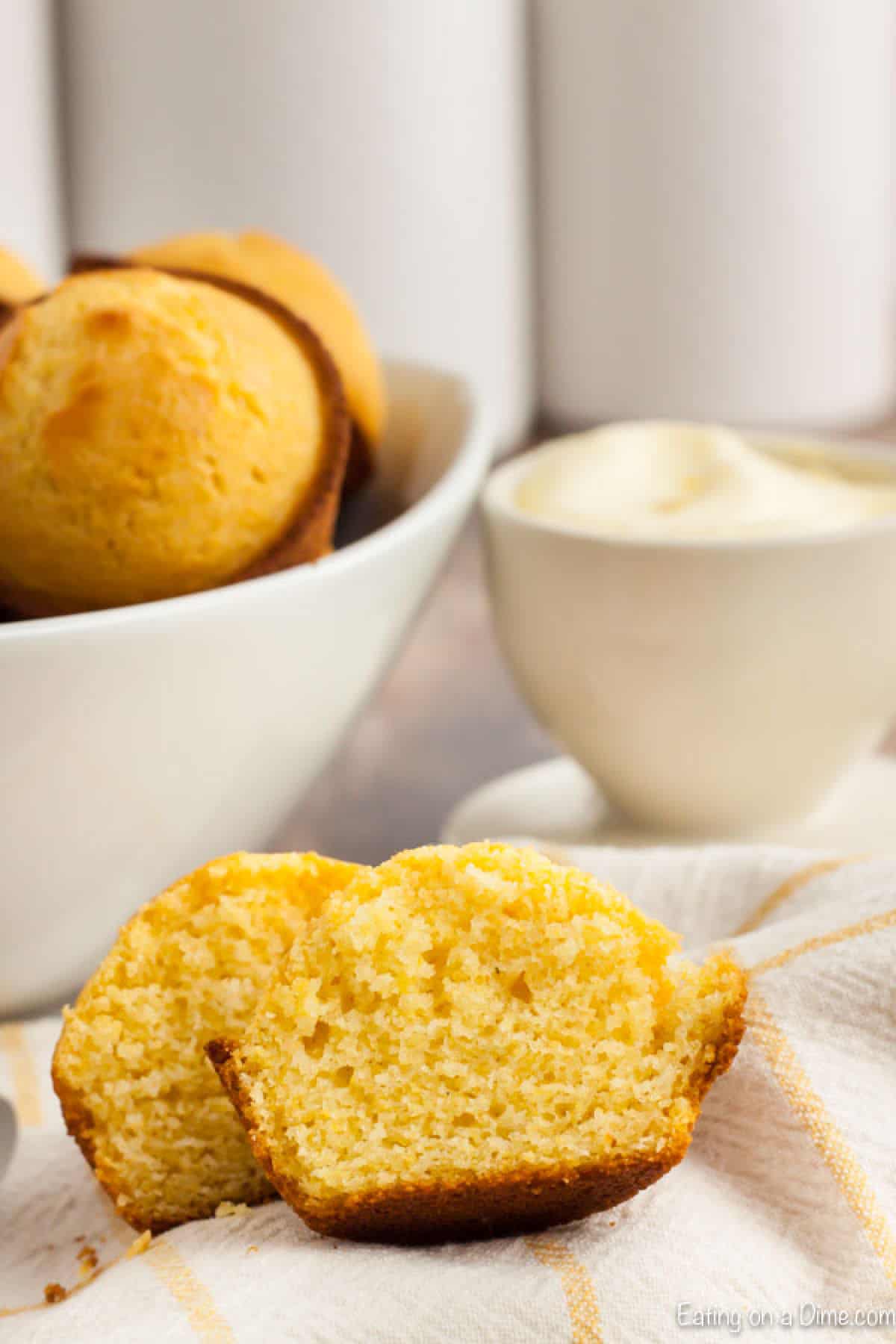 Cornbread Muffins are just so easy to make and much better than those store bought mixes. This cornbread muffin recipe is delicious and a family favorite. corn muffin cut in half