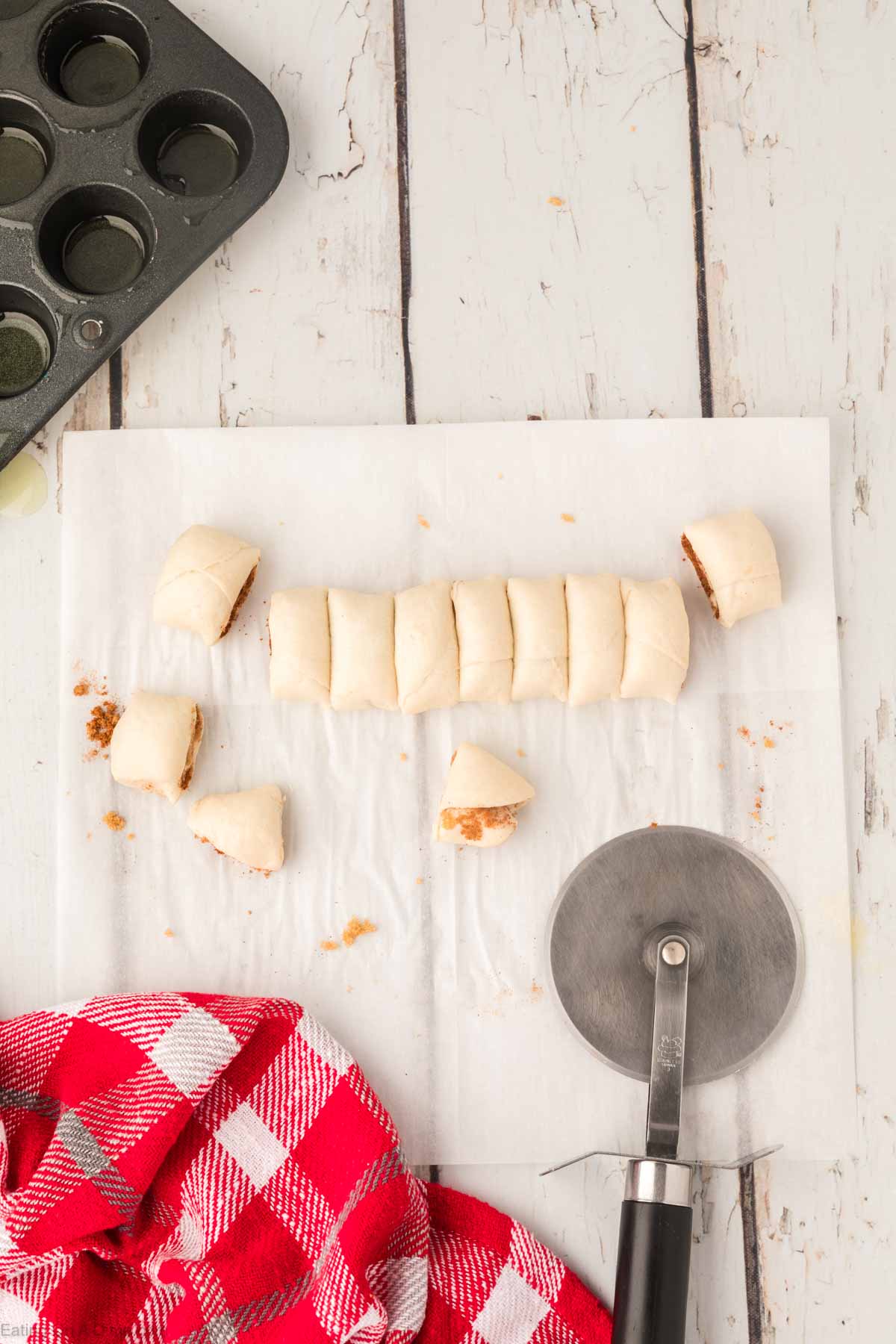 Slicing the biscuits into small rolls