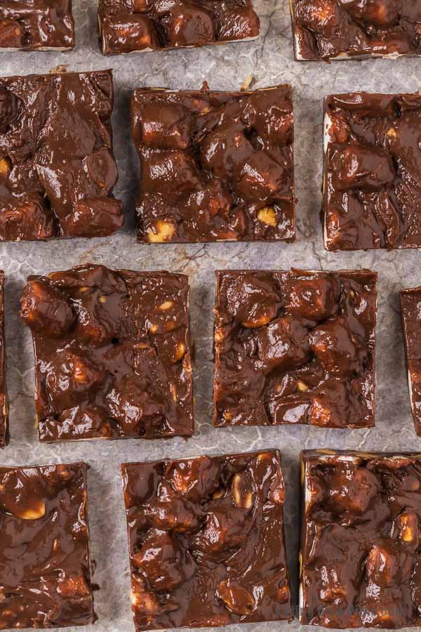 Squares of rocky road fudge on a baking sheet.