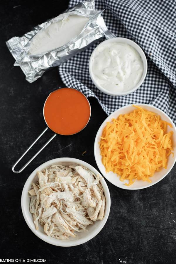 Cooked Shredded Chicken, buffalo wing sauce, cream cheese, ranch dressing, cheese