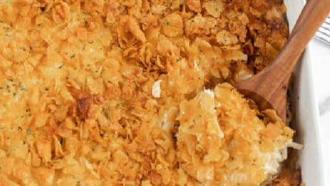 Close up image of a 9x13 casserole dish a cheesy chicken hashbrown casserole.
