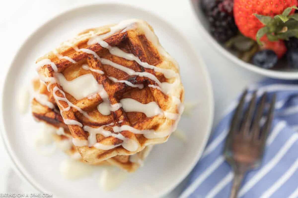 Waffles with a drizzled glaze on top.