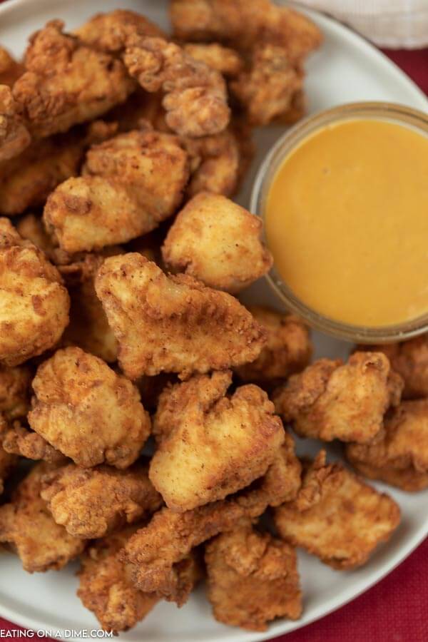 Plate of copycat chick fil a nuggets with honey mustard. 