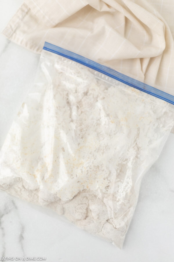 Ziplock bag with flour and chicken.