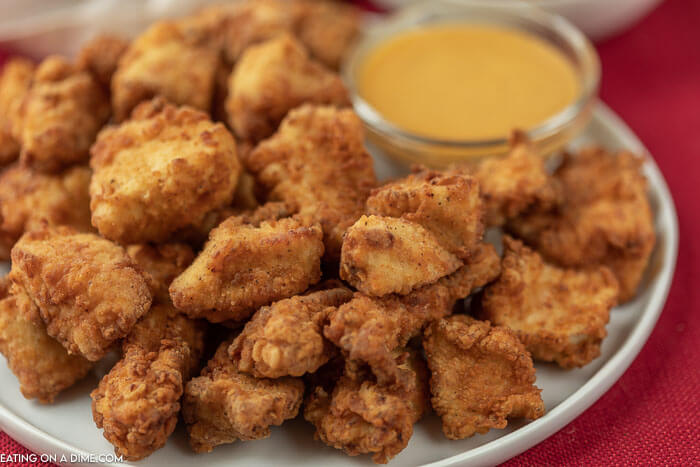 Plate of copycat chick fil a nuggets with honey mustard. 