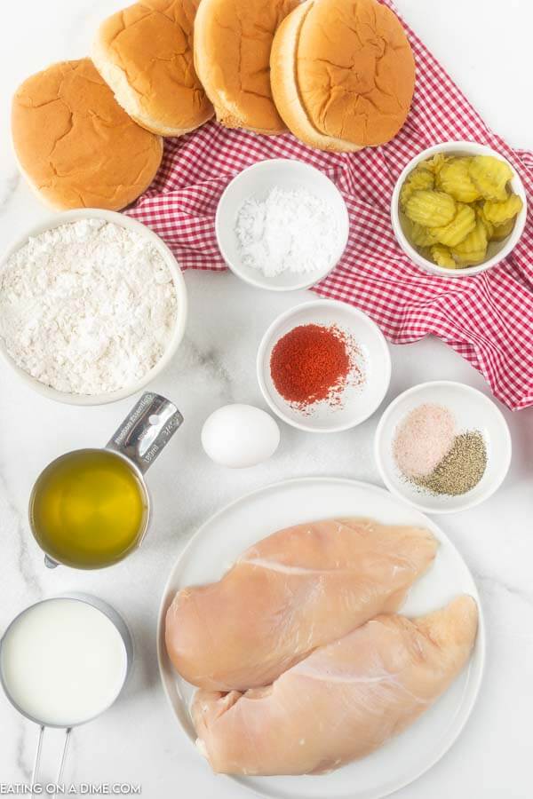 Ingredients for recipe: buns, chicken, pickles, flour, seasoning, pickle juice, milk. 
