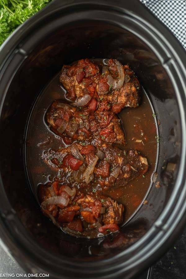 Close up image of cooked balsamic chicken in the crock pot. 