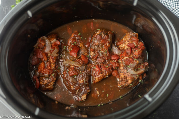 Close up image of balsamic chicken in the crock pot. 
