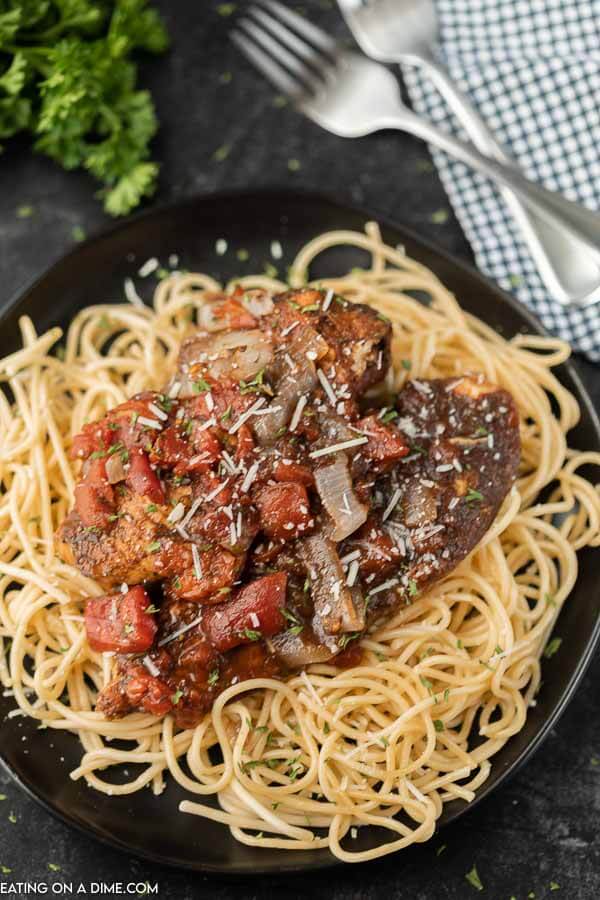 Close up image of balsamic chicken on pasta. 