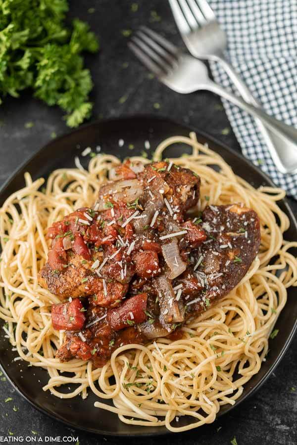 Close up image of balsamic chicken on pasta. 