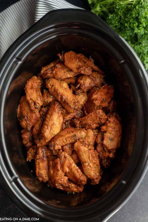 Crock Pot of cooked chicken wings.