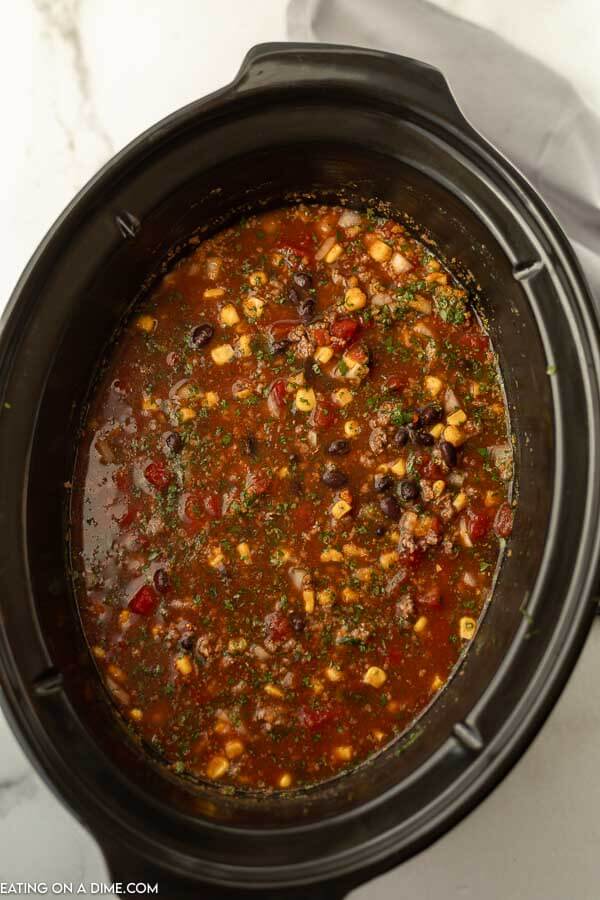 Black bean soup with cilantro in the crock pot.