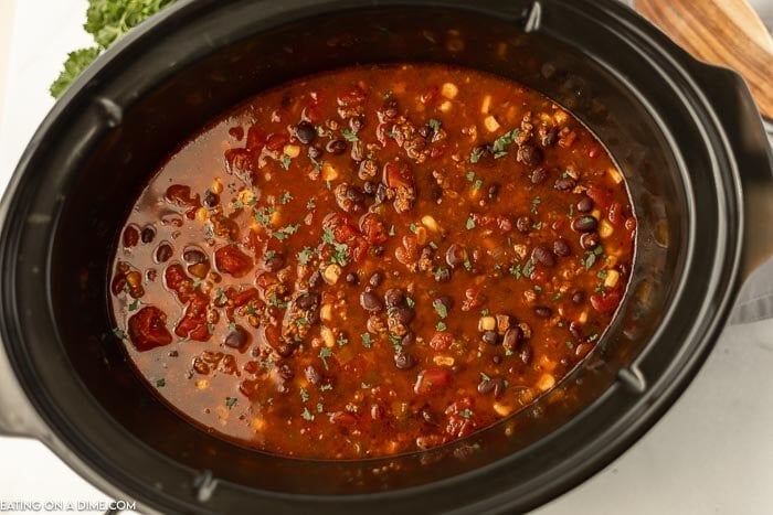 Black bean soup with cilantro in the crock pot. 