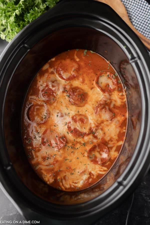 Close up image of pizza chicken in the crock pot. 