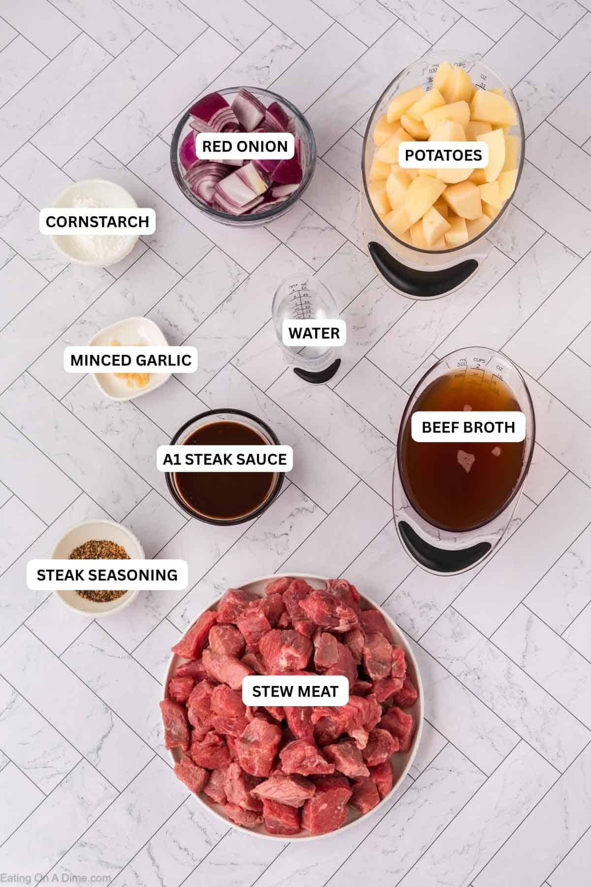 Ingredients for recipe: red onion, potatoes, cornstarch, minced garlic, water, beef broth, steak seasoning and stew meat.