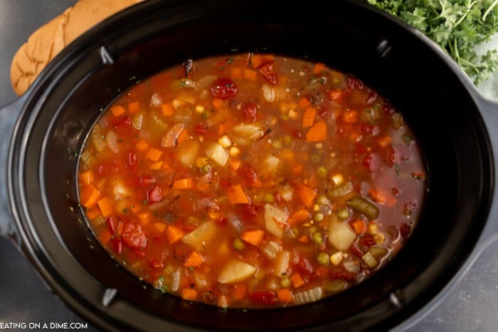 Close up image of Vegetable Soup in a crock pot. 
