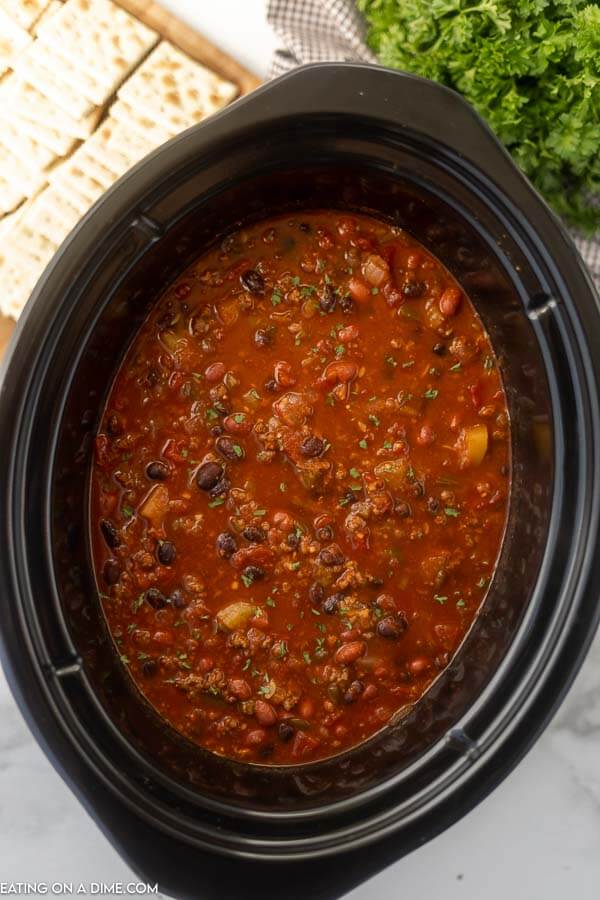 Close up image of vegetable and beef chili in a crock pot. 