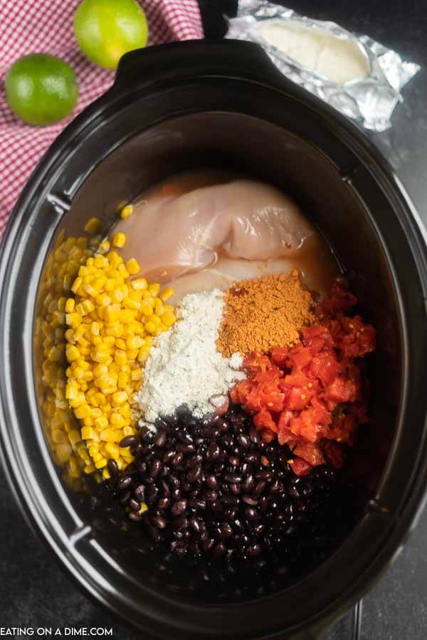 Close up image of the ingredients added to the crock pot. It is uncooked. 