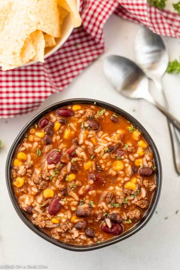 Bowl of Crockpot Taco Rice Soup with a spoon.