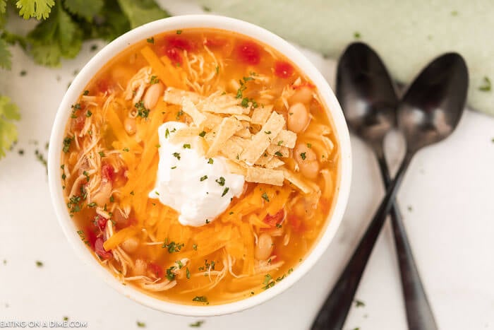 Bowl of Instant Pot Chicken taco Soup topped with sour cream. 